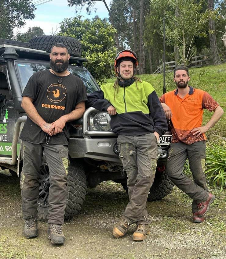 The team of tree loppers at Ranges Tree Service in the Yarra Valley, standing by the work ute.